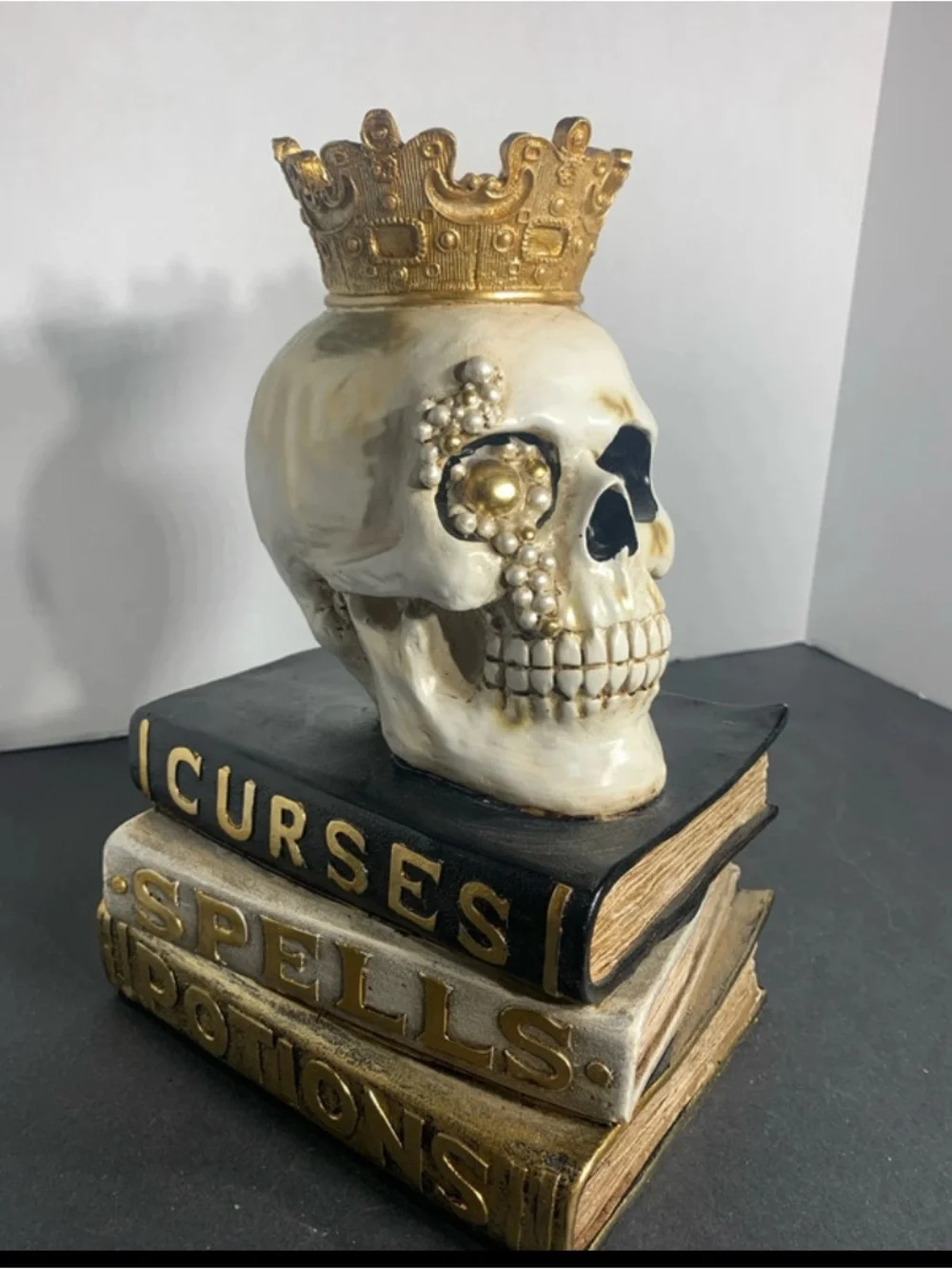 Decorative White and Gold Skull on Stacked Spell Books - Home Accent